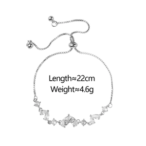 Elegante bracciale regolabile in argento con fiocco in zircone e ciondoli di cristallo
