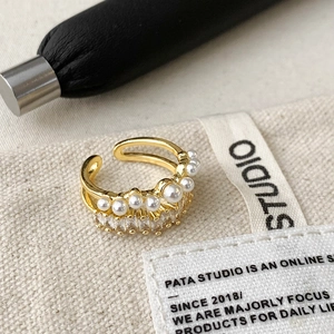 Double-layer gold open ring with lustrous pearls and baguette cubic zirconia stones