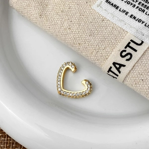 Elegant gold-plated heart ear cuff featuring shimmering white cubic zirconia micro-pave