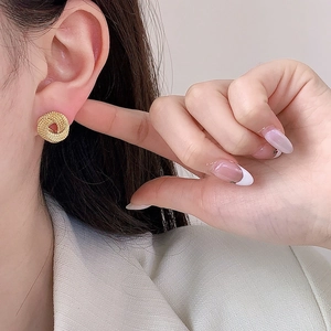 Elegant gold twisted round stud earrings for women featuring a textured woven design