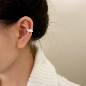 Chic multi-layer silver ear cuff for women shown on model for a minimalist fashion look