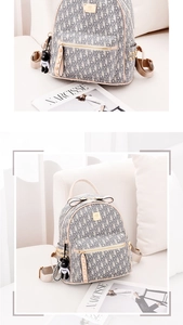 Detail of grey monogram canvas backpack with pink leather trim and black bear charm