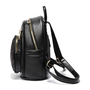 Mini black leather backpack for women with purple sequins and gold zippers in side view