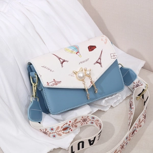 Chic blue and white patchwork crossbody bag with Paris theme and cat pearl pendant