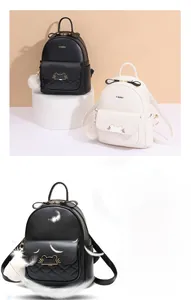 Detailed close-up of a mini backpack with cat-ear golden lock and quilted texture