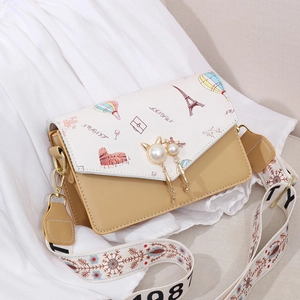 Chic Eiffel Tower print crossbody bag with cat-ear pearl buckle and wide shoulder strap