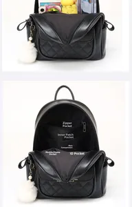 Internal view of black quilted backpack with multiple storage pockets for phone and umbrella