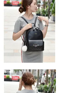 Detail view of large black faux leather backpack with quilted pattern and cat ear metal buckle