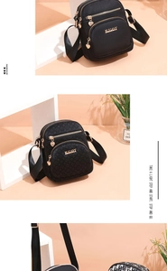 Detailansicht der leichten Nylon-Umhängetaschen mit goldenen Herzanhängern und Logos