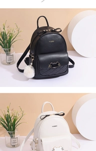Detail of mini quilted leather backpack with bow accent and cat-ear buckle design