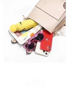 Flat lay showing large capacity of apricot leather backpack with tablet and accessories