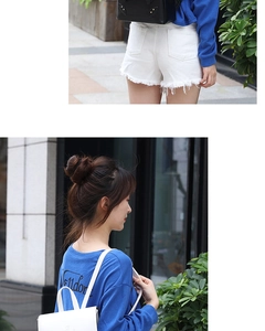 Mini leather backpack styled with blue sweatshirt and white frayed denim shorts