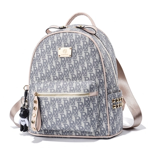 Fashionable beige and grey jacquard backpack with stud details and bear charm