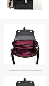 Detail view of the interior compartments and organized storage of the black crossbody bag