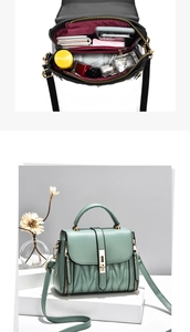 Close-up of mint green vintage handbag featuring wave pleated texture and metal clasp