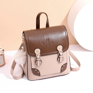 Brown and beige vintage backpack for women with bear motif and fuzzy charm accessory