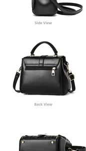 Detail view of black leather handbag featuring back zipper pocket and metal base studs
