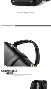 Detail view of the black matte leather handbag base with gold feet and wide handle