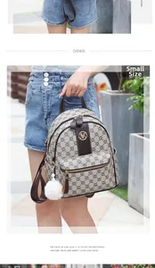 Small vintage backpack with brown monogram canvas and white fluffy pompom detail