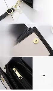 Détails du sac en cuir noir avec fermoir magnétique et fermeture éclair dorée polie