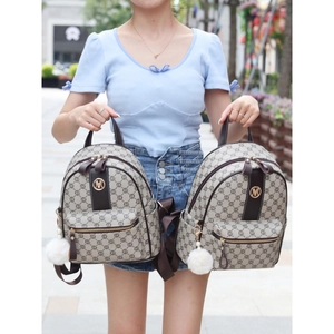 Women's vintage khaki-brown monogram backpack with plush charm and metal M logo