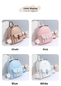 Détail de mini sacs à dos en cuir souple en kaki, rose, bleu et blanc avec pompons en fourrure