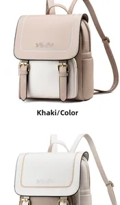 Detail view of khaki and white soft leather backpacks with embossed rose pattern and buckles