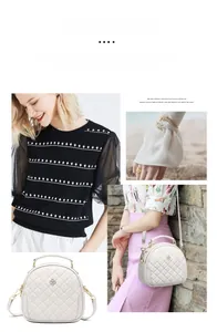 Detail of white quilted crossbody bag featuring golden clover metal clasp and chain strap