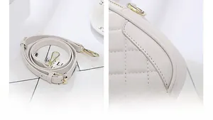 Detail of cream quilted leather round crossbody bag featuring premium gold-tone hardware