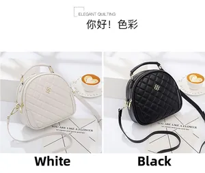 Quilted semi-circle crossbody bags in black and white with clover metal buckle