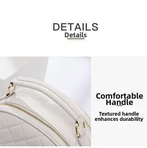 Detail of quilted beige handbag featuring gold metal D-rings and premium leather handle