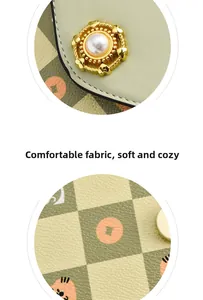 Close-up of green crossbody bag with checkered pattern and pearl gold hardware