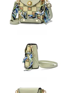 Detail view of mini crossbody bag with green checkerboard pattern and pearl flower clasp