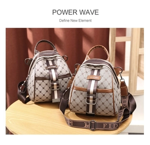 Detailed view of mini monogram backpacks in coffee and khaki with broad straps