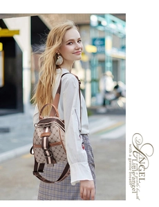 Outdoor shot of a woman wearing a mini monogram backpack with brown leather trim details
