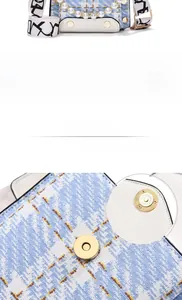 Detail of tweed crossbody bag featuring pearl chain and golden magnetic buckle closure