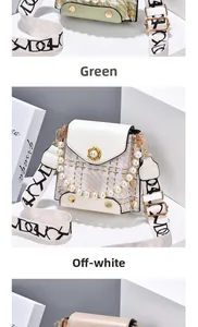 Close-up of green and white plaid bags with pearl handle and golden flower clasp
