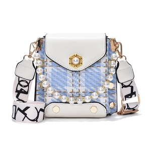 Mini checkered tweed handbag with pearl handle and wide crossbody strap for women