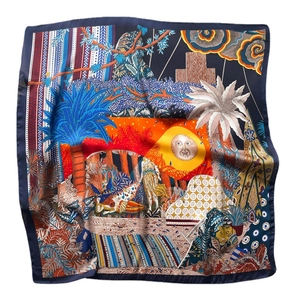 Luxurious square silk scarf featuring blue palm trees, tigers, and tropical jungle patterns