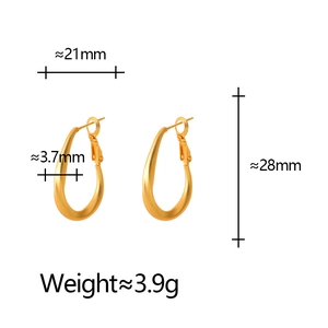 Matte gold oval hoop earrings measuring 28mm by 21mm with elegant geometric U-shaped design