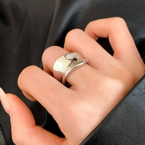 Polished silver irregular wave wide band ring with a modern minimalist mirror finish