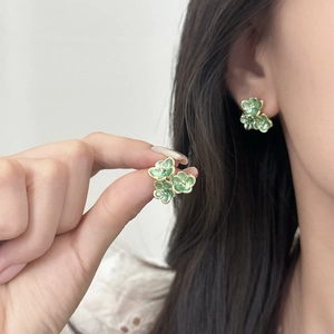 Vintage style gold flower stud earrings with green enamel floral clusters for women
