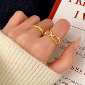Minimalist gold ring set featuring a textured band and vintage chain link design