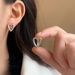 Minimalist silver hollow heart hoop earrings for women with a high-polished finish