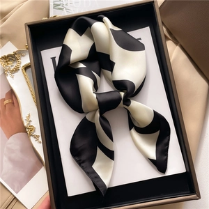 Elegant black and white polka dot silk scarf in a luxury gift box for women