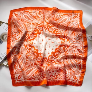 Vibrant orange paisley silk-like square scarf with elegant vintage prints for women