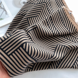 Close-up of lightweight herringbone stripe silk scarf showing soft fabric texture and drape