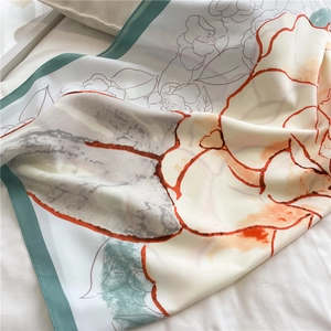 Detailed close-up of camellia print on 90x90cm silk scarf with soft fabric texture