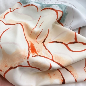Detail of camellia silk scarf showing matte twill texture and floral pattern