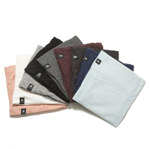 Flat lay of colorful ribbed knit neck warmers with cozy fleece lining and brand tags